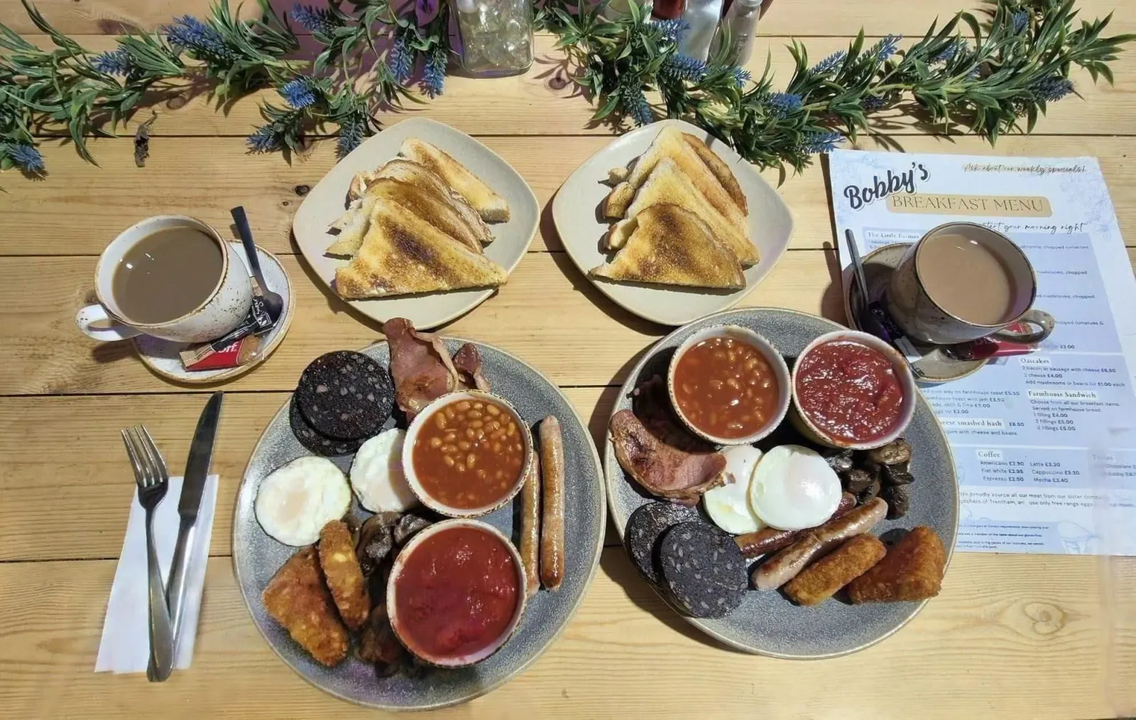 Two full farmhouse breakfasts with the Bobby's breakfast menu on the table