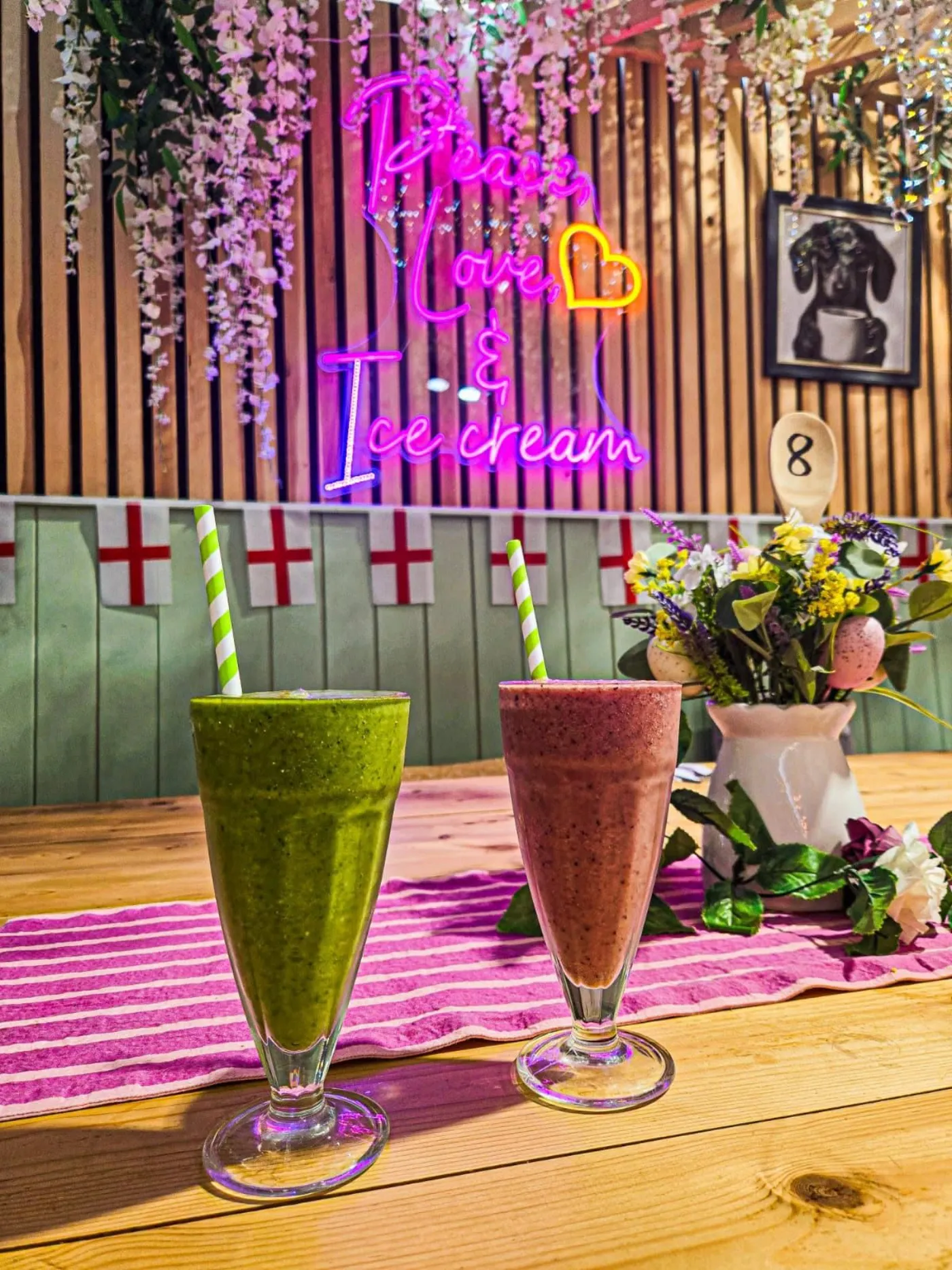 Two thick fruit milkshakes on the table in the parlour